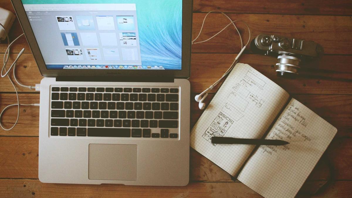 Laptop and notebook with a pen